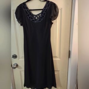 Woman's black romantic style formal dress.